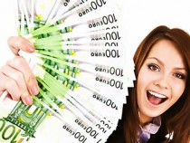 Businesswomen with group of money and laptop.